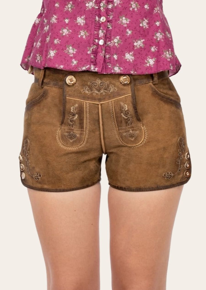 Elegant Oktoberfest Lederhosen for women, featuring floral stitching and decorative Alpine buttons.