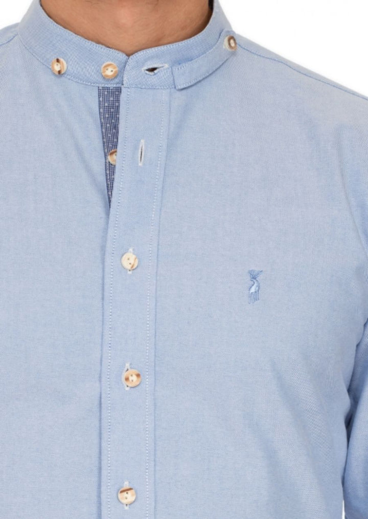 Close-up of tailored collar and button placket on premium German festival shirt with contemporary styling